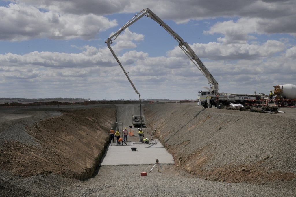 Brisbane West Wellcamp Ariport First concrete is poured for the foundations of the new Wellcamp Airport terminal, due for completion in September 2014. Photo: Bev Lacey / The Chronicle. Picture: Bev Lacey