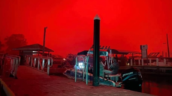 The scene on the wharf at Mallacoota, where thousands are taking refuge. Picture: Twitter@BradleyWDeacon