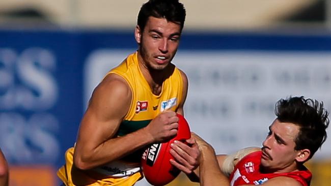 17/4/16 SANFL: Rhys Woods of the Eagles clashes with Alexander Spina of North. Eagles v North Adelaide at Woodville Oval. Picture by Matt Turner.