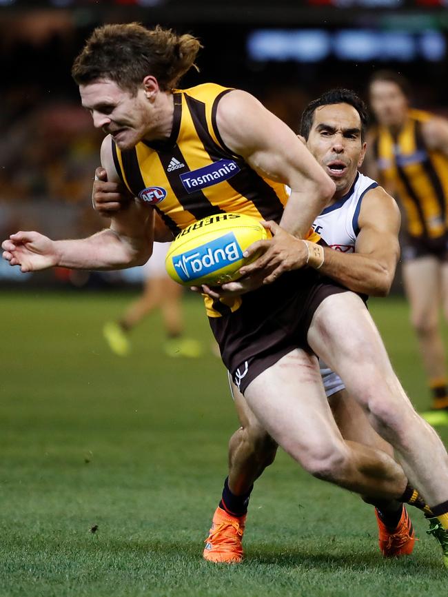 Eddie Betts lays a tackle on Hawk Blake Hardwick on Saturday night. Picture: Michael Willson/AFL Media/Getty Images