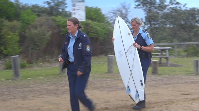 A shark bite can be seen on the tail of the surfboard. Picture: TNV