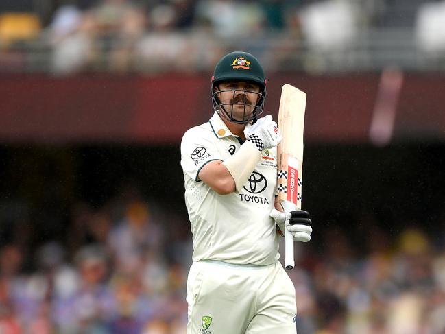 BRISBANE, AUSTRALIA - JANUARY 26: Travis Head of Australia looks dejected after losing his wicket during day two of the Second Test match in the series between Australia and West Indies at The Gabba on January 26, 2024 in Brisbane, Australia. (Photo by Bradley Kanaris/Getty Images)