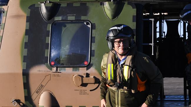 Prime Minister Scott Morrison gets off a helicopter after an aerial tour of flood affected areas in Windsor and Pitt Town today. Picture: Getty Images