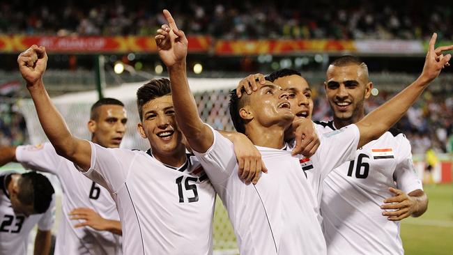 Iraq celebrate after Ahmed Yaseen Gheni scored their second goal.