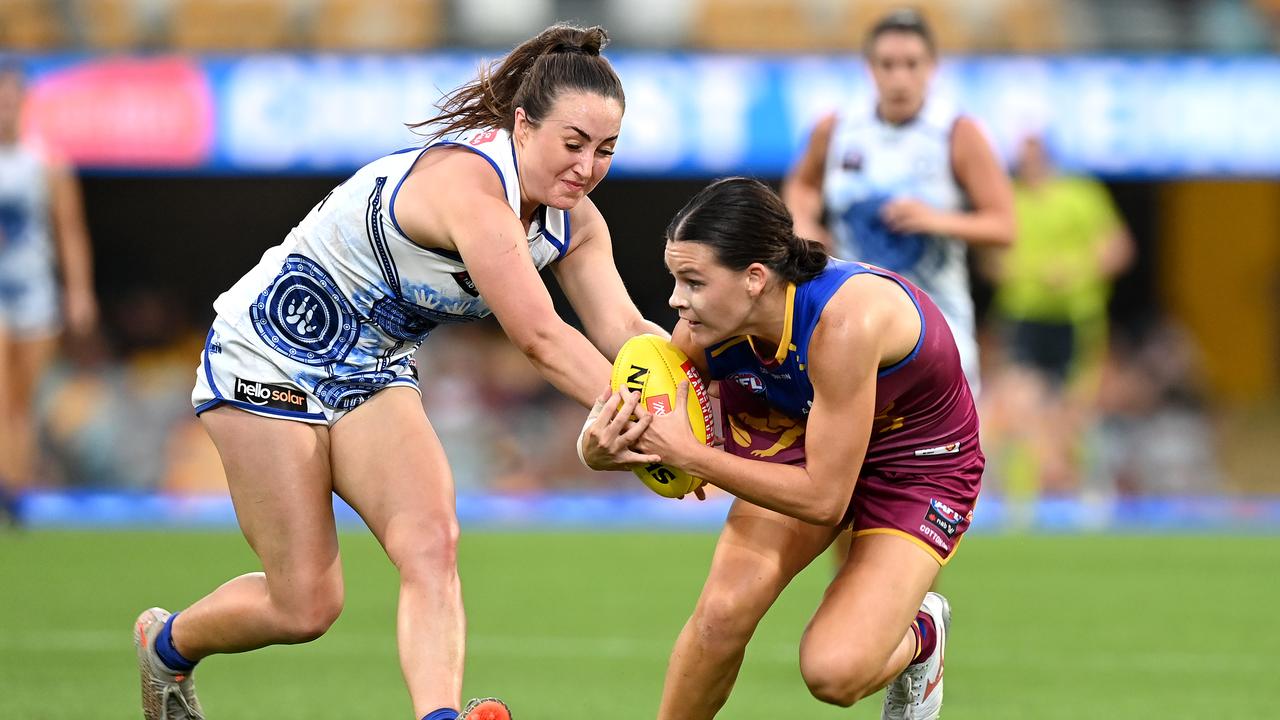 Lion Sophie Conway attempts to break away from North Melbourne’s Nicole Bresnehan. Picture: Bradley Kanaris/Getty Images