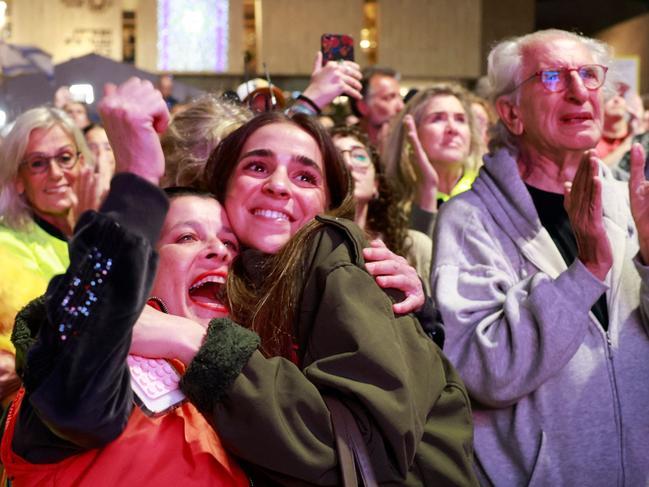 The crowds in Tel Aviv’s ‘Hostage Square’ cheered and whooped at the news that the first three hostages freed under the Gaza ceasefire deal had returned to Israel. Picture: Menahem Kahana/AFP