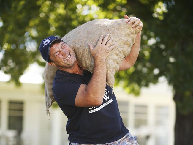 Nathan Hindmarsh pictured with a 50kg bag of potatoes getting ready for the 400m potato race in Robertson this year. Picture: Sam Ruttyn