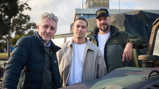 War Machine is a $100m Netflix film shooting at the RAAF base at Laverton.L-R: Producer Greg McLean, actor Blake Richardson and director and co-writer Patrick Hughes on the set of War Machine. Picture credit: Ben King.