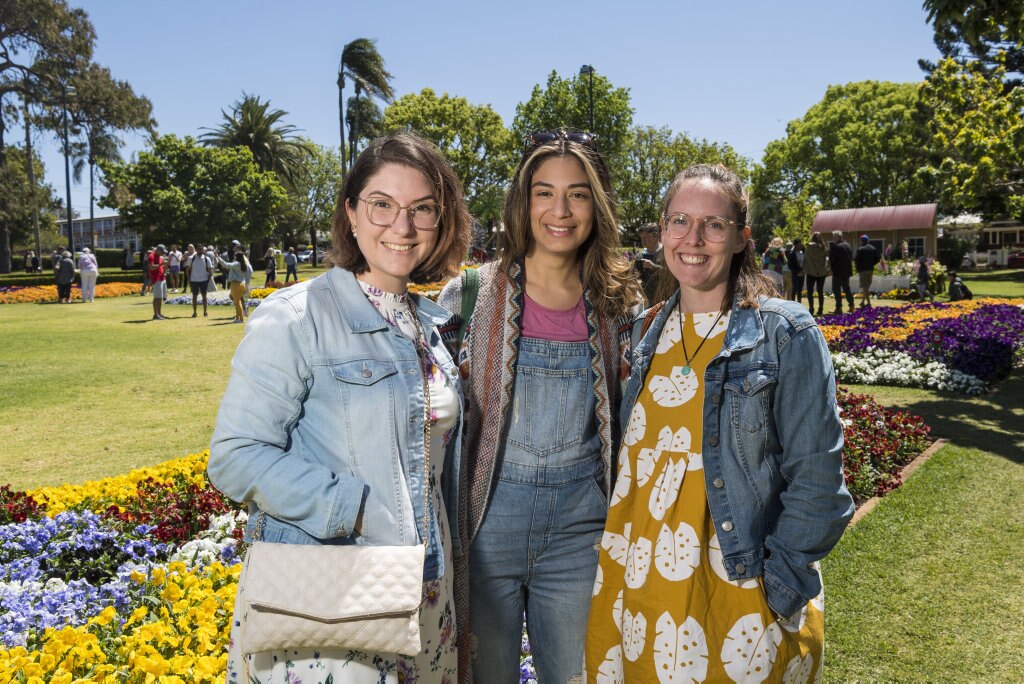 Checking out the floral display in Laurel Bank Park are (from left) Katrina Bell, Gabriela Bran and Emily Rayers during Carnival of Flowers 2020, Saturday, September 26, 2020. Picture: Kevin Farmer