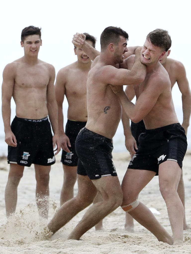 Port Adelaide Scott Lycett (left) wrestles Peter Ladhams at the Power’s training camp in Noosa. Picture Sarah Reed