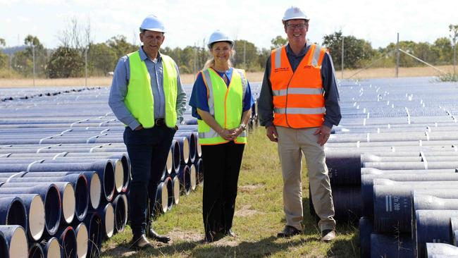 Rockhampton region mayor Tony Williams and divisional councillor Cherie Rutherford with Rockhampton MP Barry O'Rourke in front of pipes to be used for the Mount Morgan pipeline.