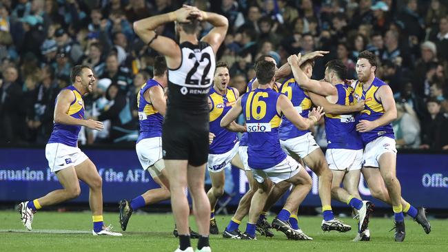 Port star Charlie Dixon stands in disbelief as West Coast’s players celebrate their extra-time elimination final win this year. Picture: Sarah Reed
