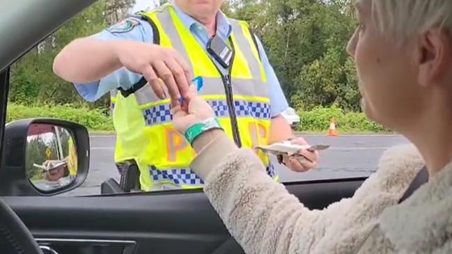 NO GLOVES: An image supplied by Greens MP Cate Faehrmann, which she said was taken by a staff member, allegedly shows the police officer conducting the RDT not wearing latex gloves, as she headed into Mardigrass on May 2, 2021. Image supplied