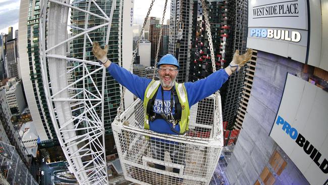 Crane operator Vinnie Del high in the sky above Melbourne. Picture: David Caird