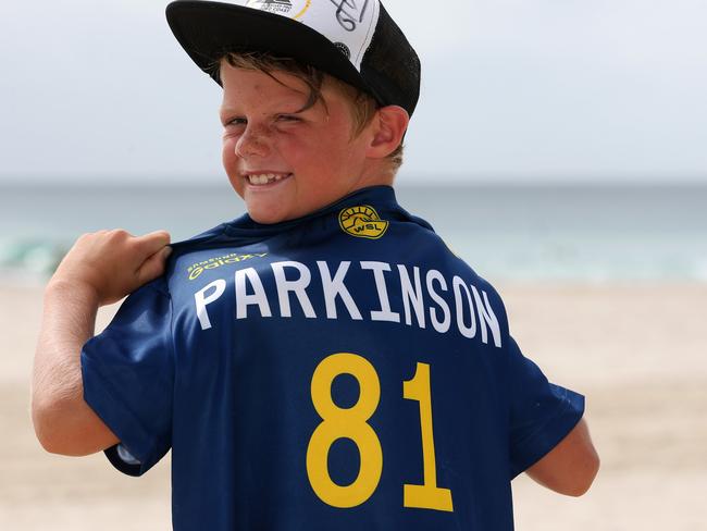 Kobe O'Brien, 8, is delighted he got a shirt of his favourite surfer Joel Parkinson during the 2016 Quicksilver and Roxy Pro surfing at Snapper Rock, Gold Coast. Picture: Regi Varghese