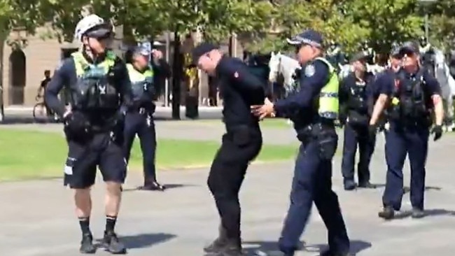 Mr Sewell, centre, was arrested outside the Adelaide War Memorial on Australia Day. Picture: 7NEWS