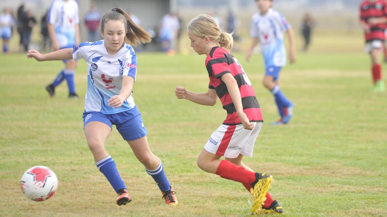 Grafton City Blitz (white) take on Yuraygir Bears (red and black) in the North Coast Football CL 14s at Rushforth Park on Saturday, July 11, 2020. Photo: Mitchell Keenan