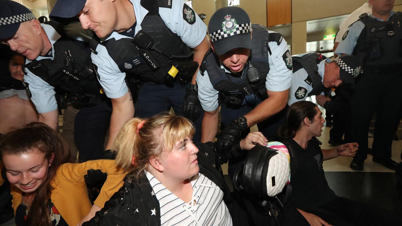 Protesters were forcibly removed by AFP officers from Parliament House in Canberra. Picture: Gary Ramage