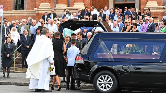 Mourners outside the funeral of Billy J Smith at the Holy Spirit church in New Farm. Picture: AAP/John Gass