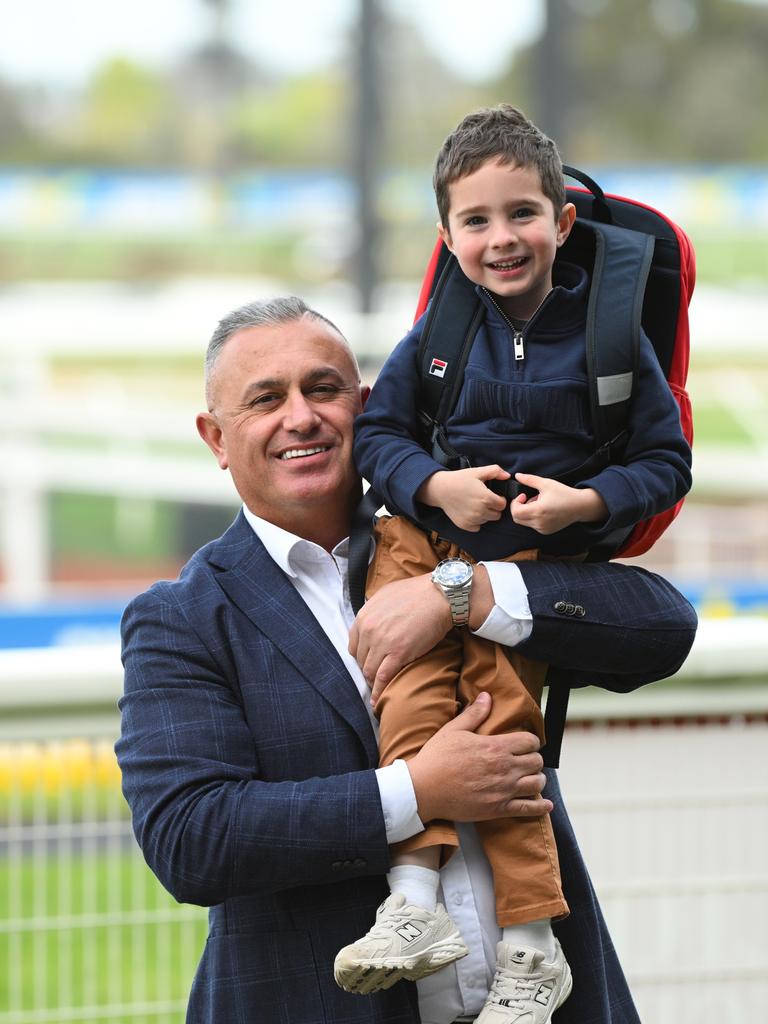 John Kanga, MRC board member is seen with Oakley McNeil, son of jockey Jye McNeil at Sandown racecourse. Picture: Getty