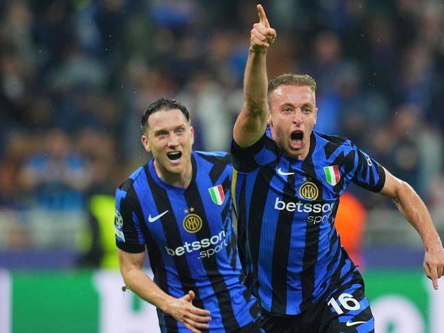 Inter Milan's Davide Frattesi, center, celebrates after scoring his side's fourth goal during the Champions League semifinal second leg soccer match between Inter Milan and Barcelona at San Siro stadium in Milan, Italy, Tuesday, May 6, 2025 (Spada/LaPresse via AP)
