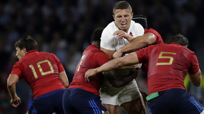 England’s Sam Burgess is tackled by France’s Flugence Ouedraogo and Yoann Maestri.