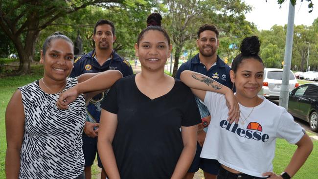 Ataya Pearson, 18, Mara Sewter, 19, and Nahlani Ah Kit, 18, with NRL Cowboys House career transition officers Karl Adams and Antonio Winterstein at James Cook University. The girls will be the home's first graduates to attend university.