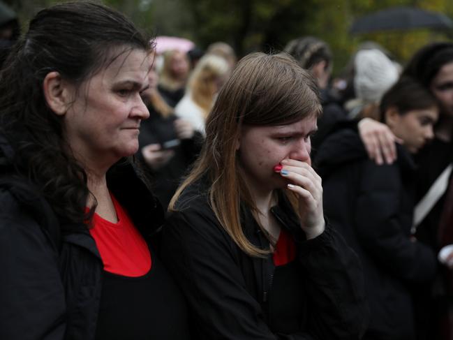 Fans become emotional as they gather at the Peter Pan statue during a tribute event for One Direction singer Liam Payne in Hyde Park on October 20, 2024 in London. Picture: Alishia Abodunde/Getty Images