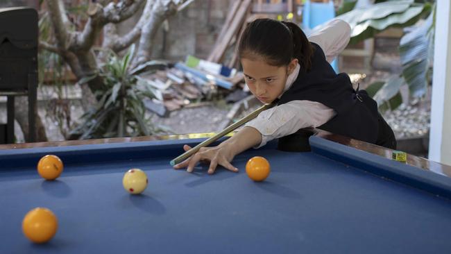 Lilly Meldrum, 11, has just come back from world under 16 snooker titles where she came fourth. She is the Australian under 18 champion. Photographed at home in Kenmore.