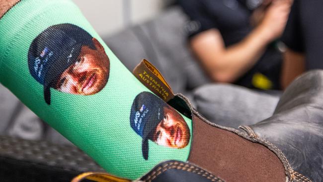 Socks with skipper Tom Slingsby's face on them.