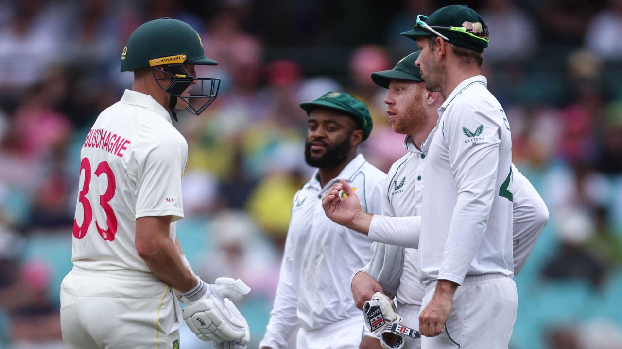 Marnus Labuschagne talks with South African players after he was given not out. Picture: David Gray / AFP