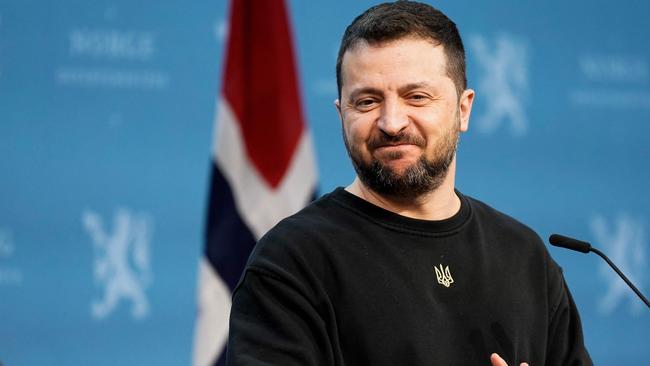 Ukrainian President Volodymyr Zelensky smiles during a press conference at the government's representative residence in Oslo on December 13, 2023, after their meeting of the  leaders of the five Nordic nations, key backers in Kyiv's fight against Russia's invasion. (Photo by Cornelius Poppe / NTB / AFP) / Norway OUT