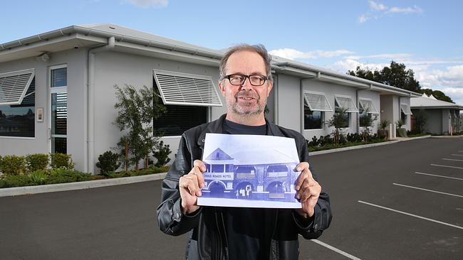 Liverpool Historical Society president Glen op den Brouw with an original photo of the Crossroads Hotel in Casula. Picture: Carmela Roche