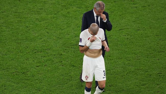 Pepe with Fernando Santos, Head Coach of Portugal, after their loss to Morocco. (Photo by Alexander Hassenstein/Getty Images)