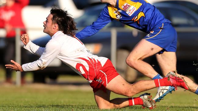 Braydon Avola fires out a handball for Avenel. Picture: Yuri Kouzmin