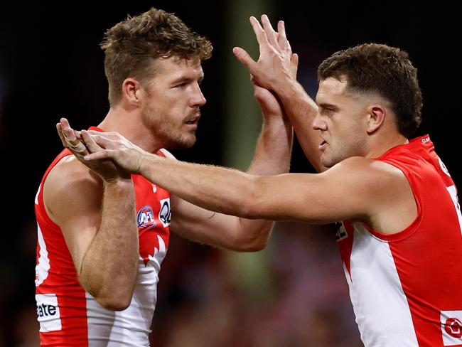 SYDNEY, AUSTRALIA - SEPTEMBER 20: Luke Parker (left) and Tom Papley of the Swans celebrate during the 2024 AFL First Preliminary Final match between the Sydney Swans and the Port Adelaide Power at The Sydney Cricket Ground on September 20, 2024 in Sydney, Australia. (Photo by Michael Willson/AFL Photos via Getty Images)