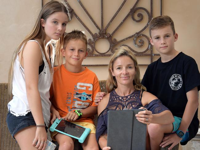 Kirsty Sleep, with her children Oscar, 7, Ollie 11, and Jessie 15, says the system enabled her to protect her children without having to “micromanage” their internet use. Picture: Simon Bullard