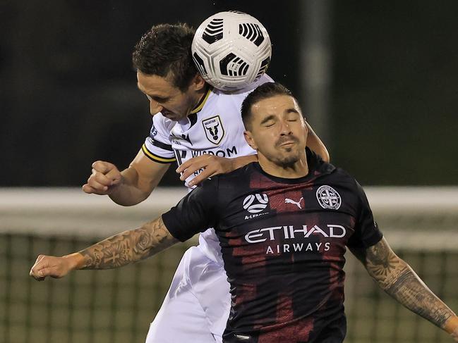 SYDNEY, AUSTRALIA - APRIL 24: Aiden O'Neill of Melbourne City goes up for a header with Mark Milligan of Macarthur FC during the A-League match between Macarthur FC and Melbourne City at Campbelltown Stadium, on April 24, 2021, in Sydney, Australia. (Photo by Mark Evans/Getty Images)