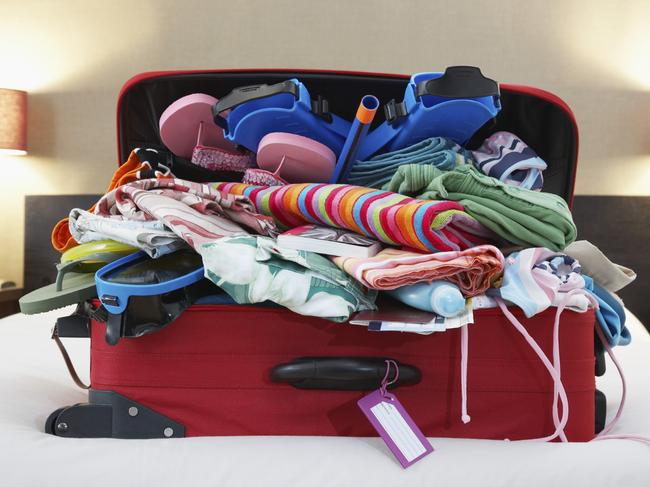 ESCAPE: WHAT TO PACK .. Sarah Nicholson story .. overpacked suitcase on holiday. Picture: iStock
