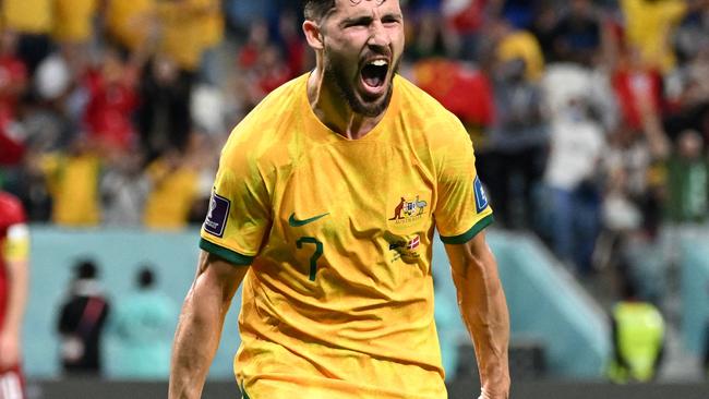 TOPSHOT - Australia's forward #07 Mathew Leckie celebrates scoring his team's first goal during the Qatar 2022 World Cup Group D football match between Australia and Denmark at the Al-Janoub Stadium in Al-Wakrah, south of Doha on November 30, 2022. (Photo by Chandan KHANNA / AFP)