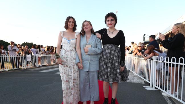 Amelia Coombs, Louise Langham and Jirja McKenzie at the Benowa State High Formal at Aquis Park Convention Centre in Bundall. Photograph : Jason O'Brien