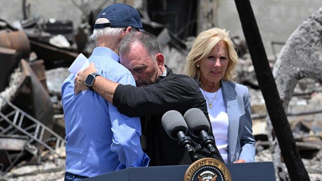 US President Joe Biden is embraced by Hawaii Governor Josh Green as he visits an area devastated by the Hawaiian bushfires. Picture: AFP