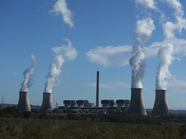 05/05/2023. Gerard Spinks, 59, Bayswater plant assistant manager, has worked in coal fired plants for more than four decades and is concerned about what will happen to workers as the economy detransitions. Photographed with  Bayswater Power station in the background, 15 minutes south of Muswellbrook in NSW. Britta Campion / The Australian