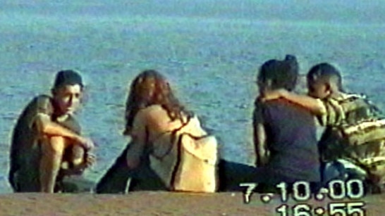 Police surveillance video of gang rapist Mohammed Skaf (left) talking to girls on Bondi Beach, in October 2000, just before his arrest.