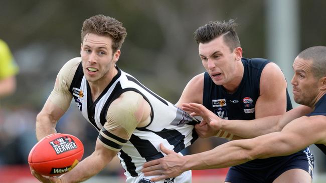 Narre Warren’s Nathan Foote is tackled by Berwick pair Lucas Jellyman-Turner and James Magner. Picture: Chris Eastman