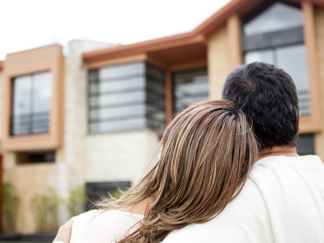 Generic photo of an Australian couple looking at property