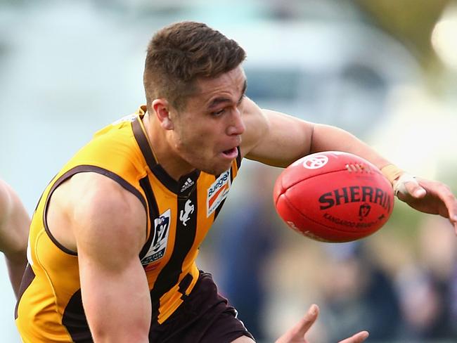 MELBOURNE, AUSTRALIA - SEPTEMBER 05: Shem Tatupu of the Hawks gathers the ball during the VFL Qualifying Final match between the Box Hill Hawks and Footscray Bulldogs at Box Hill City Oval on September 5, 2015 in Melbourne, Australia. (Photo by Robert Prezioso/AFL Media/Getty Images)