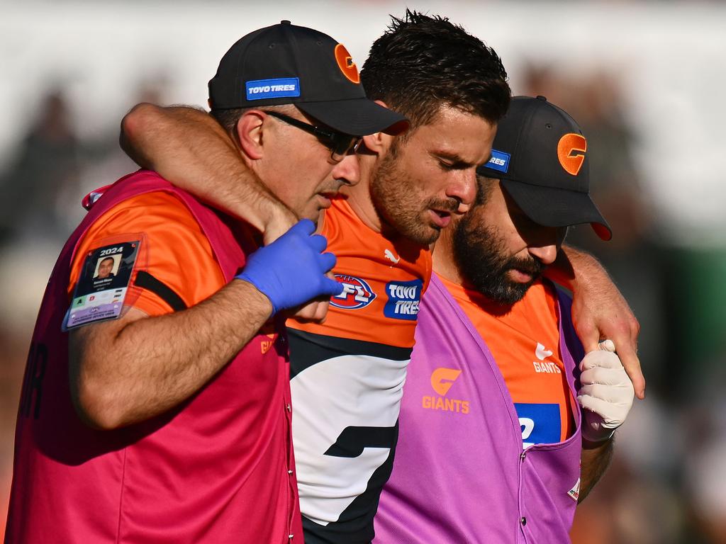 Coniglio was helped from the field but has avoided an ACL tear. Picture: Morgan Hancock/Getty Images