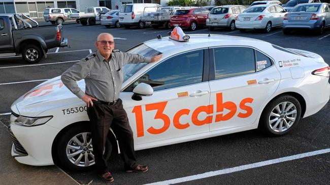 SMOOTH MOVE: Phil Shield from 13cabs with one of the new-look taxis. Picture: Mike Knott BUN080719CABS1