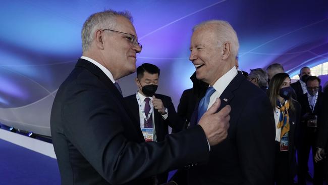 Scott Morrison chats to US President Joe Biden at the G20 official welcome and a family photo in Rome on Saturday. Picture: Adam Taylor